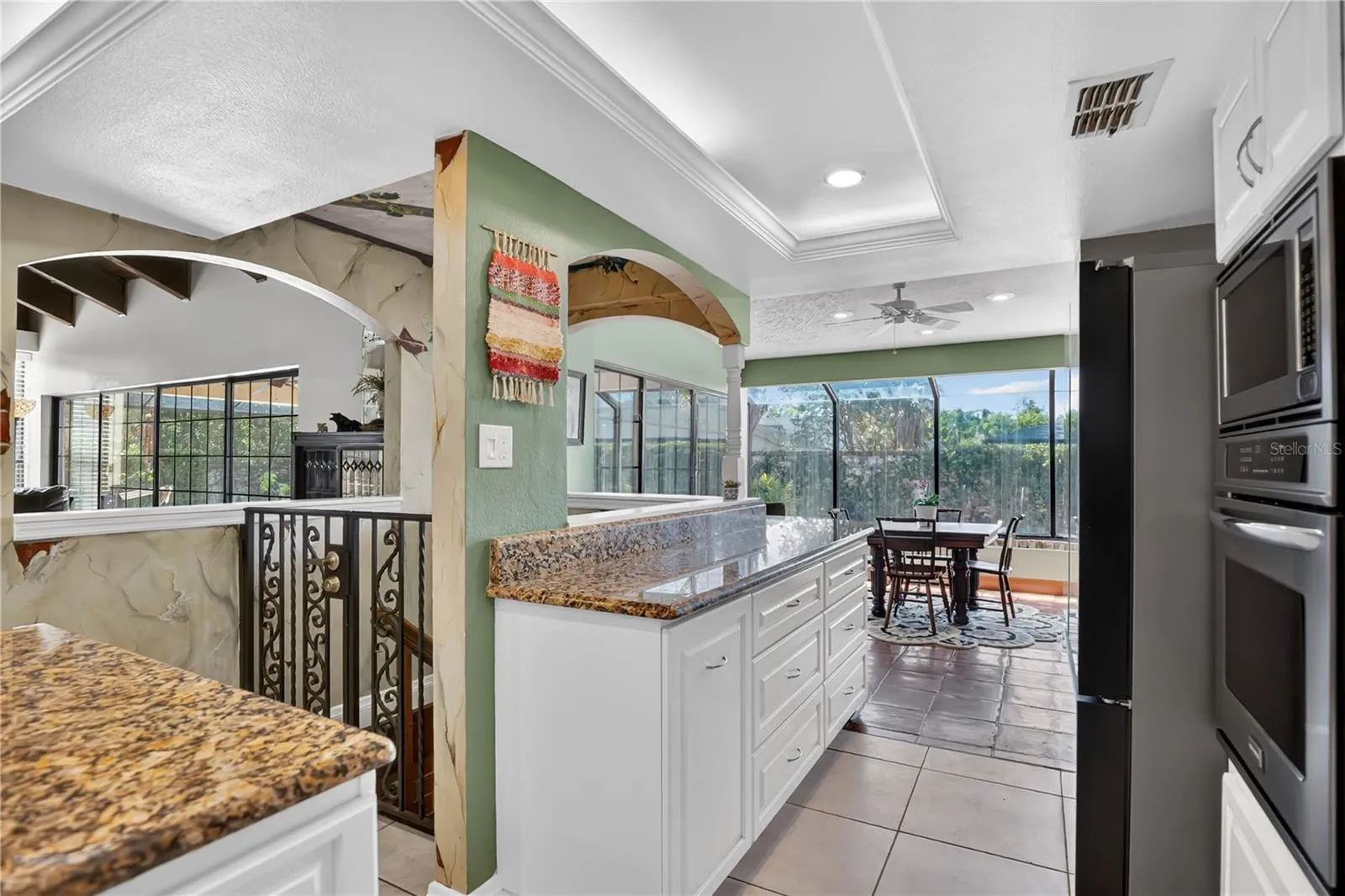 The wrought iron gate leads to the wine cellar.