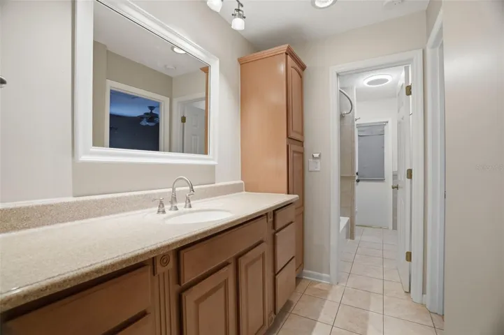 Guest bathroom / walk way to guest bedroom three and door showing separate shower and toilet area