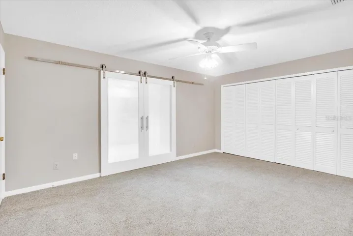 New barn style doors in primary bedroom suite.