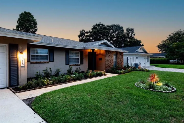 Front of house at twilight.