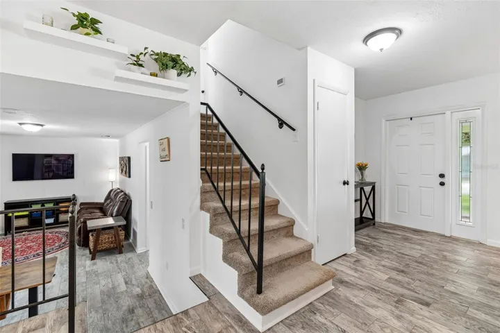 Stairs down to family room and guest bedroom and bath; and stairs up to all bedrooms and bathrooms.