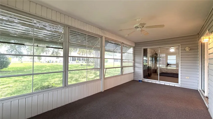 Enclosed lanai with sliding door access to primary bedroom
