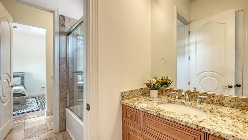 Second Floor - Jack-and-Jill bath with two private vanity areas joined by a shared shower and water closet
