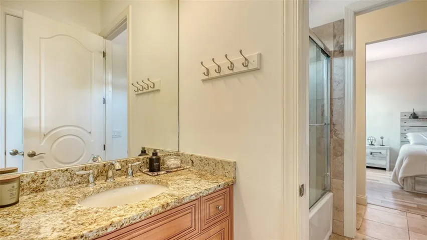 Second Floor - Jack-and-Jill bath with two private vanity areas joined by a shared shower and water closet