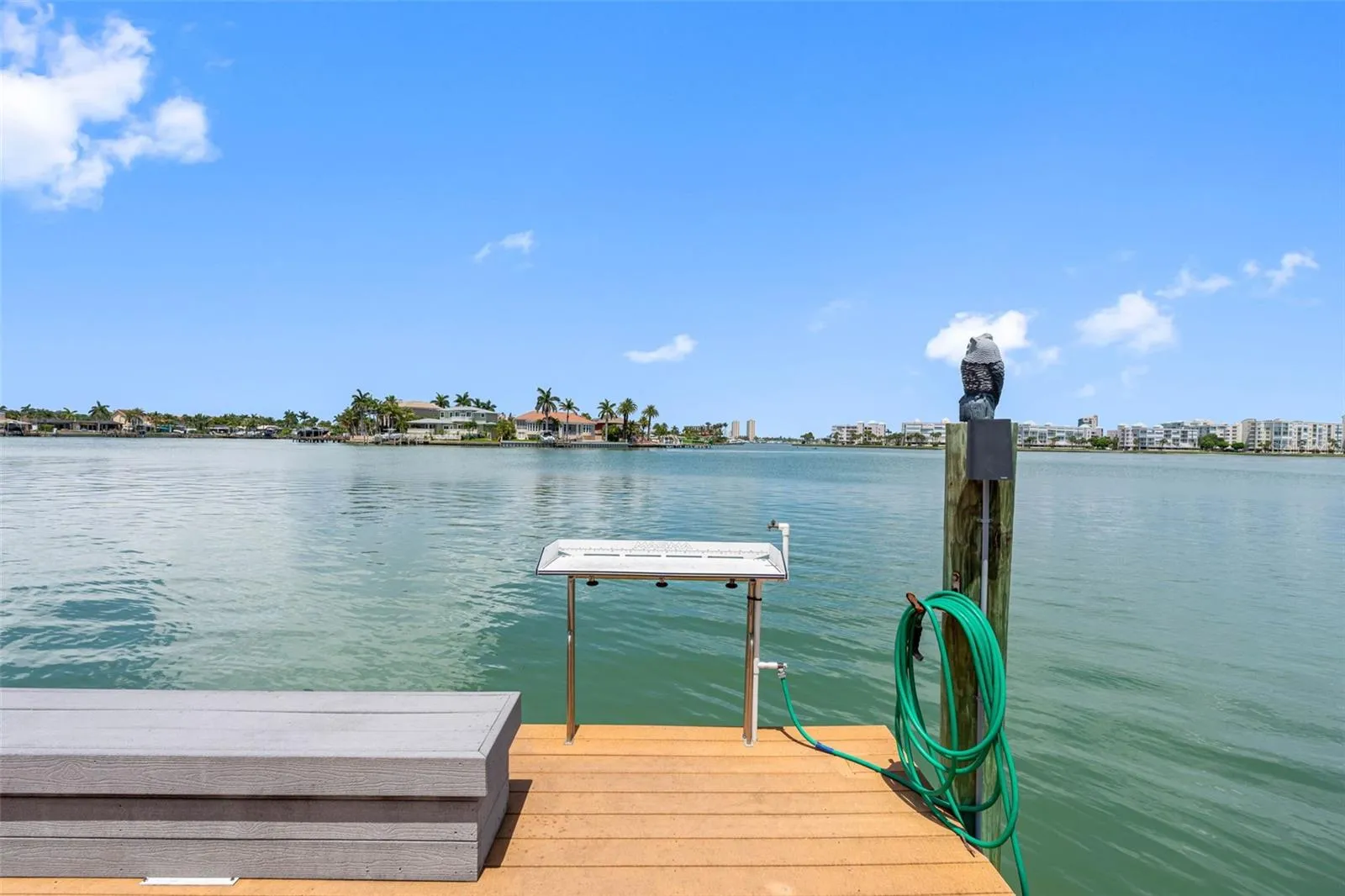 Fishing dock includes a cutting table with water. Fishing dock is lighted at night