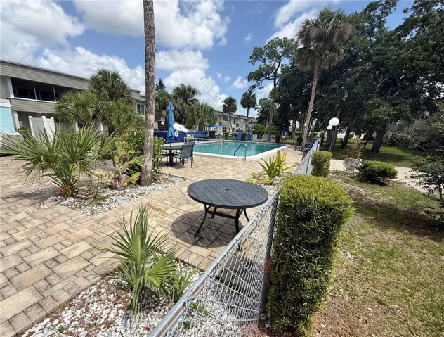 Steps away is the patios and sparkling pool