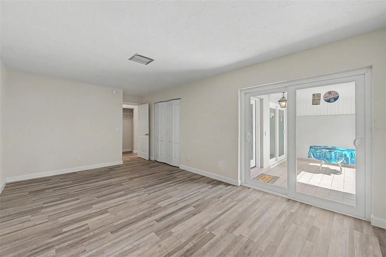 2nd Bedroom with Sliding Door Access to Courtyard.