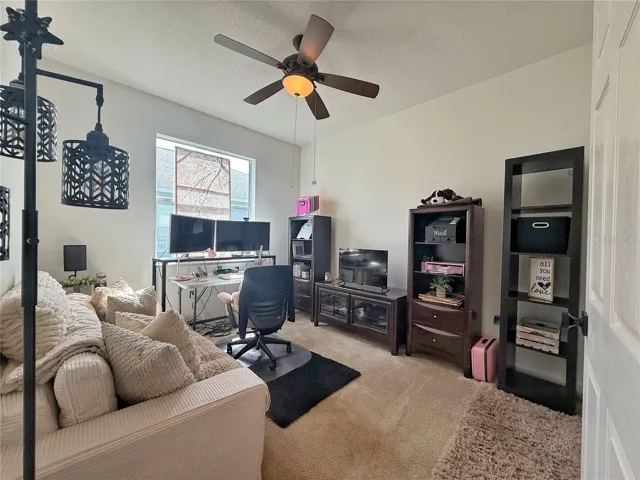 Bedroom two with built-in closet, and ceiling fan
