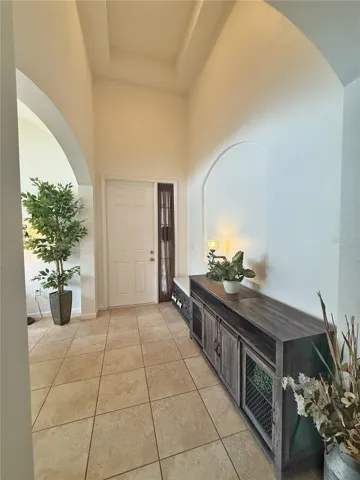 Additional view of Entry and tray ceiling with ceramic tile flooring