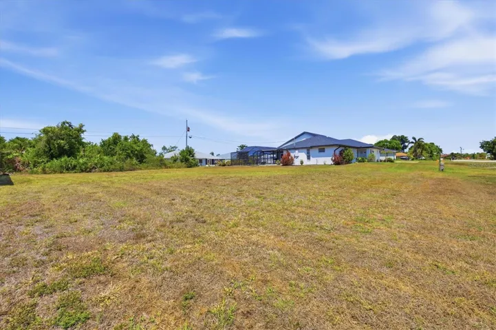 VIEW OF ADJACENT LOT AND HOME