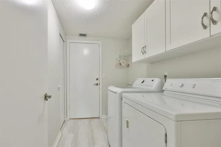 LAUNDRY HAS EXTRA STORAGE AND LAUNDRY TUB.