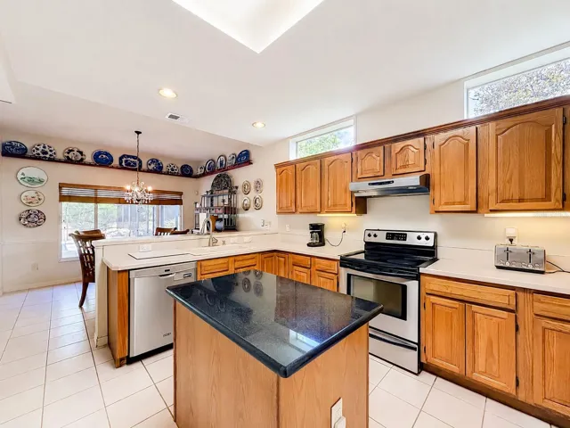 Spacious kitchen with center island and ample cabinet storage