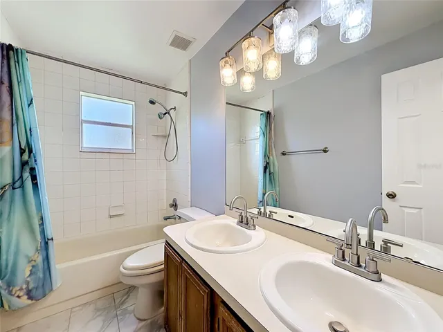 Full guest bathroom conveniently located near secondary bedrooms
