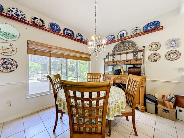 Bright breakfast area overlooking the backyard and pool