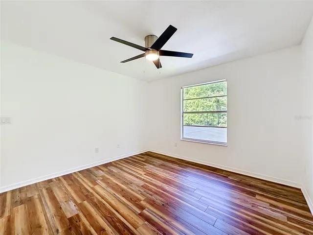 Bright and comfortable bedroom 3 with updated flooring