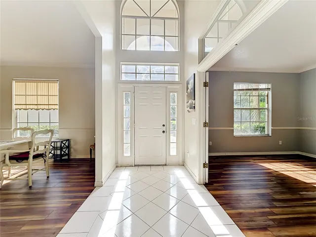 Dramatic two-story foyer with abundant natural light