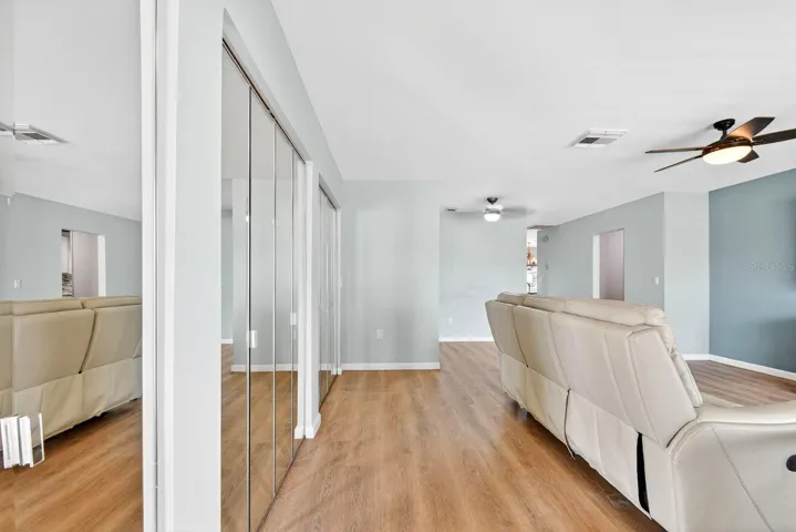 Entry showing living area to the right and storage closet on the left