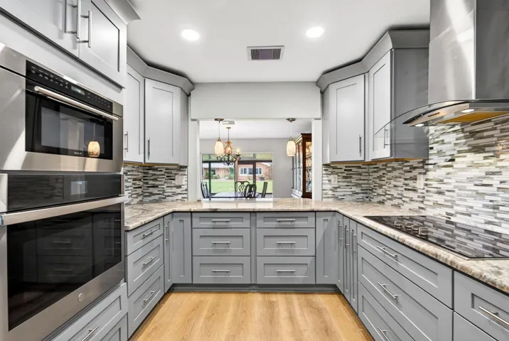 Kitchen facing into Dining and Rear of home