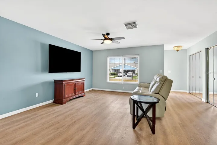 Large living area with beautiful new flooring
