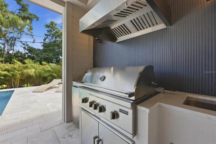 Outdoor Kitchen with Coyote Grill, Tradewinds Hood