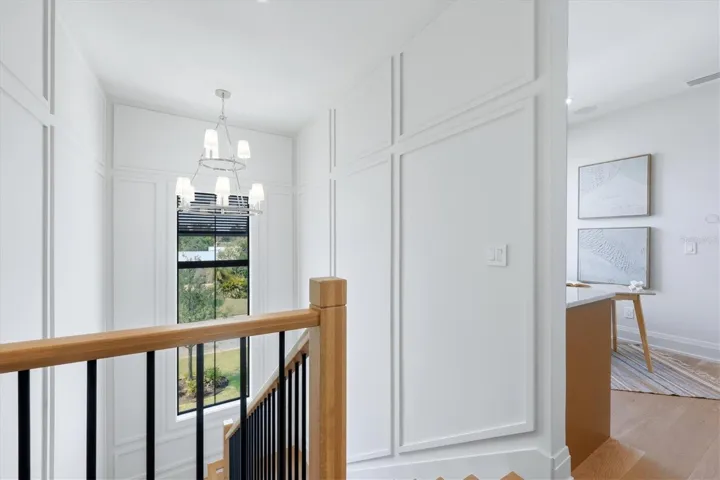 Interior stairs, 1 1/2 inch solid treads, white oak posts and handrails, metal balusters