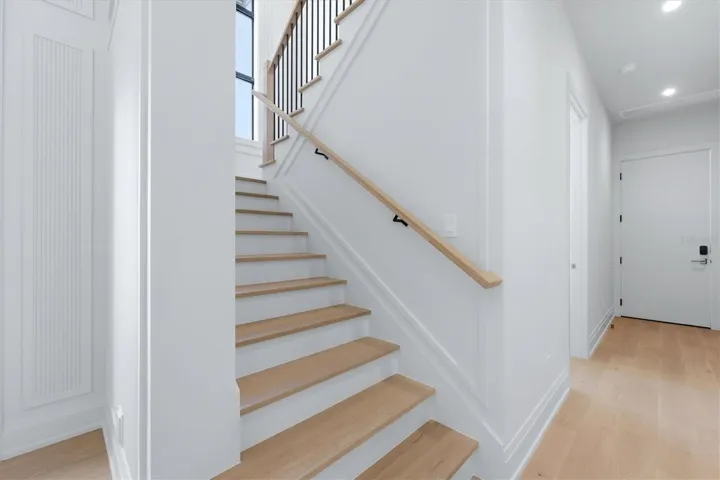 Interior stairs, 1 1/2 inch solid treads, white oak posts and handrails, metal balusters