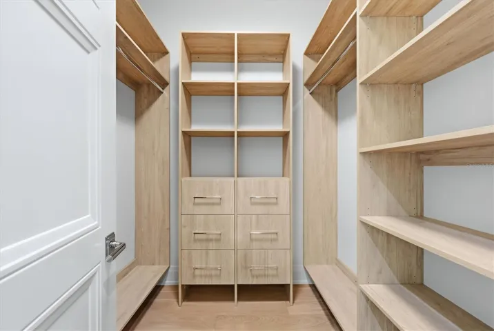 Primary Closet with custom cabinetry