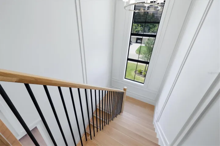 Interior stairs, 1 1/2 inch solid treads, white oak posts and handrails, metal balusters