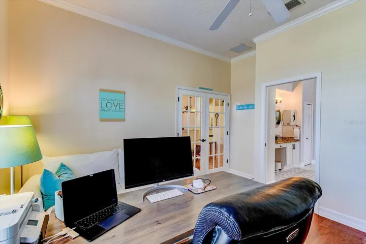 The office connects to the primary bathroom and bedroom