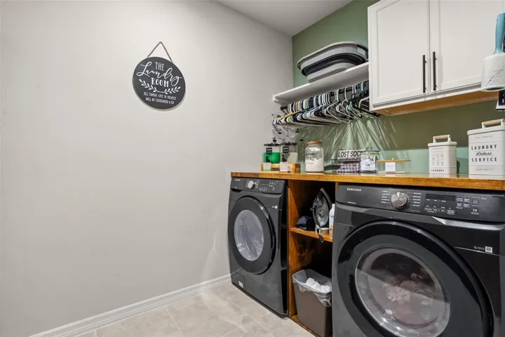Laundry room with built in cabinetry