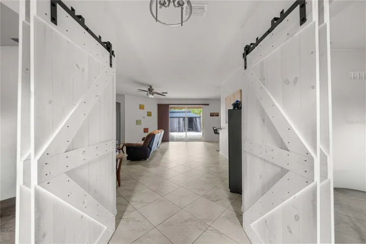 Entry area with barn doors to flex space