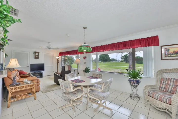 Large Climate Controlled Enclosed Lanai, Two Picture Windows Plenty of Natural Light & Built-In Storage