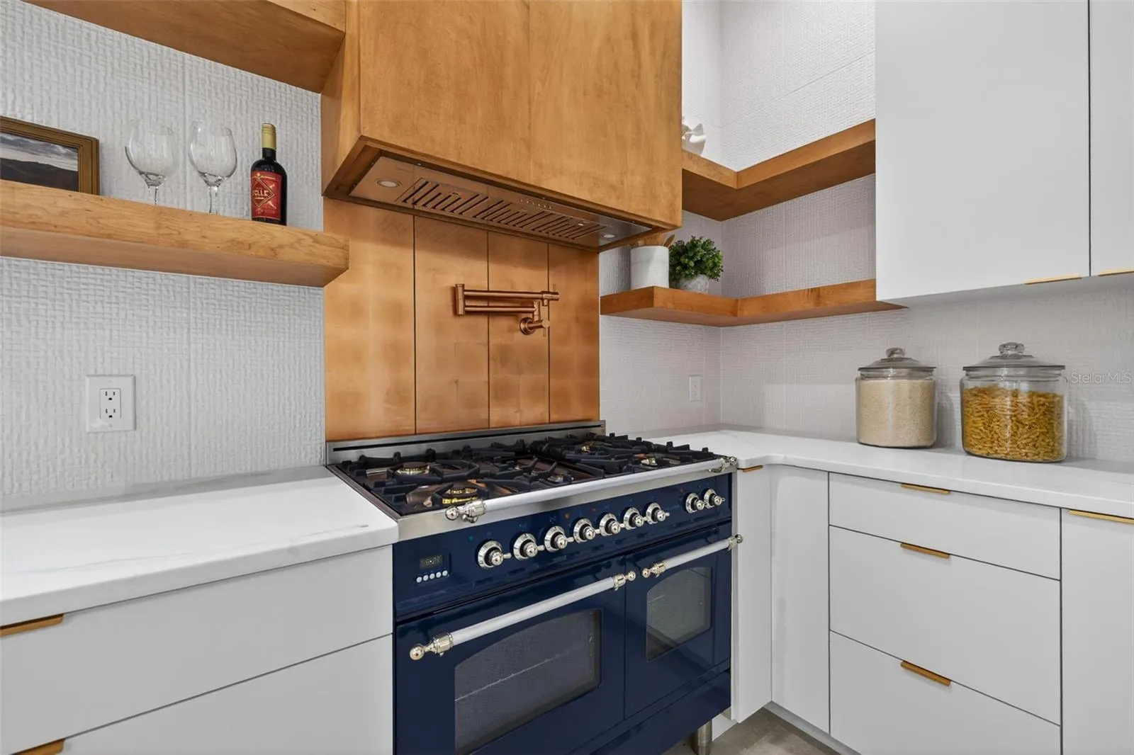 Commercial gas double oven and cooktop.