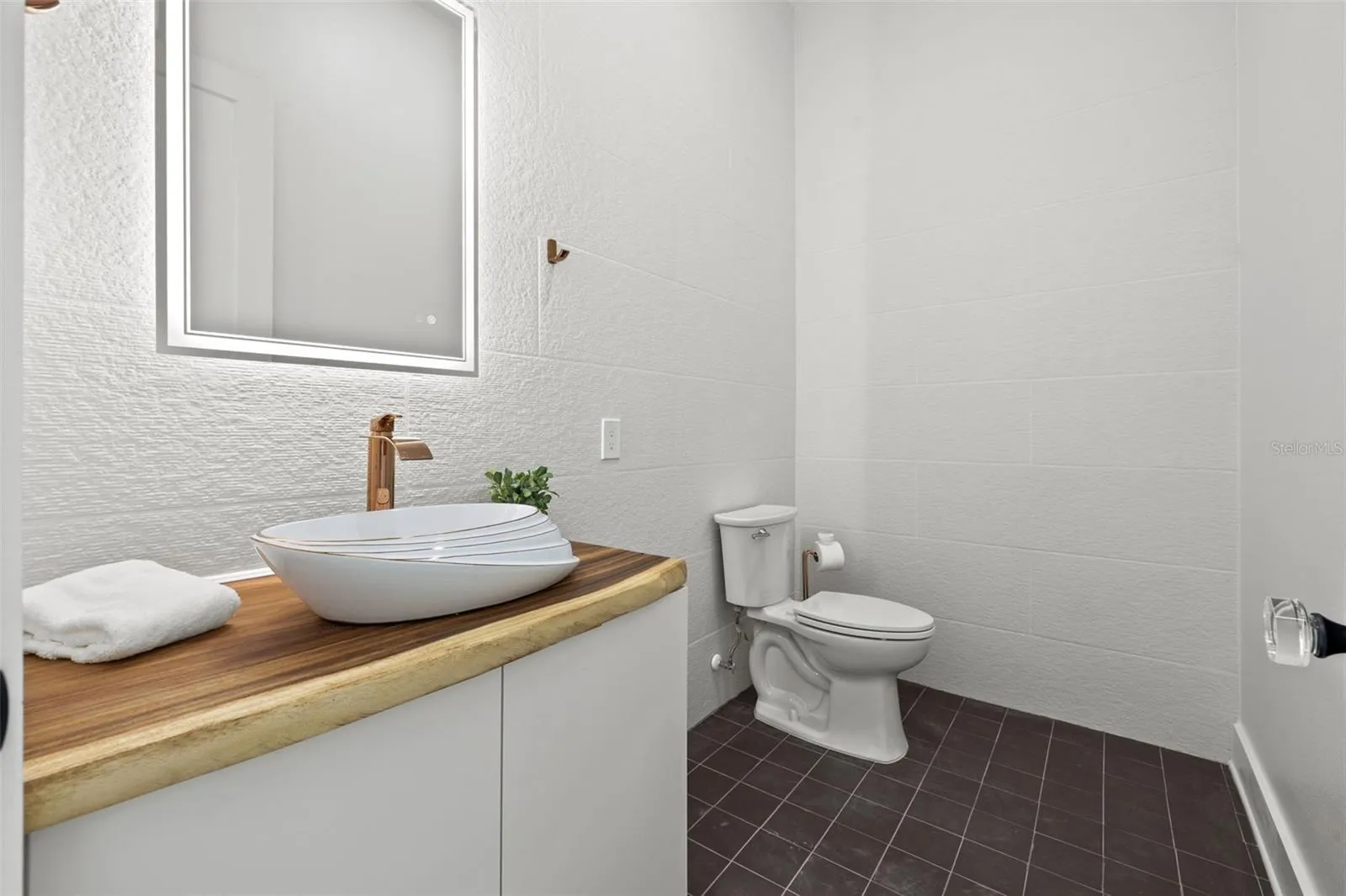 Half bathroom behind living area.