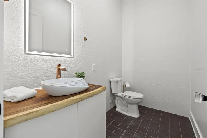 Half bathroom behind living area.