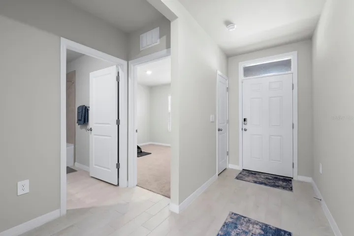 Entry foyer with 2 guest bedrooms and bathrooms at the front of the home.