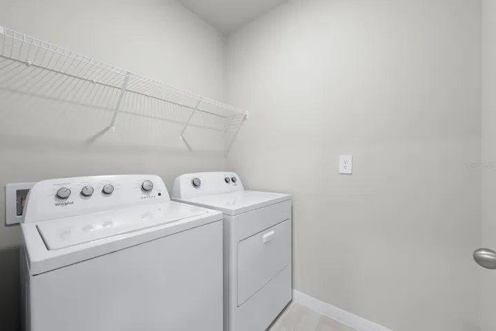 Laundry room with wire shelving.