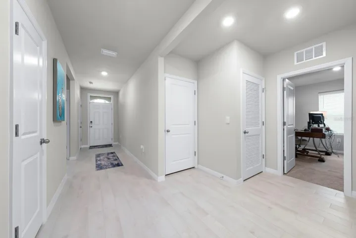 Illustrating garage door entry and entrance to guest bedroom 4.