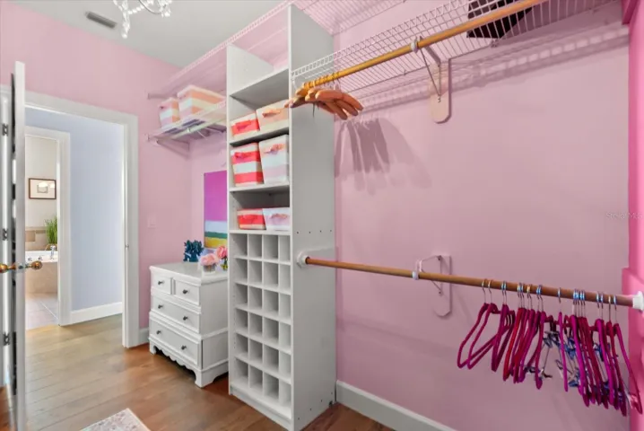 2 of 2 primary walk-in closets
