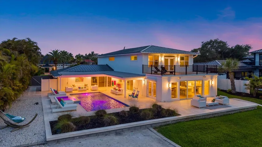 Multiple outdoor gathering spaces invite you to relax and take in stunning waterfront sunsets.