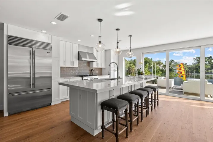 Huge kitchen island that accommodates 9 barstools!