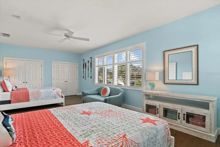 Light and bright room with large windows with plantation shutters.