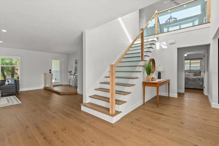 Staircase to second floor primary bedroom, bonus room and 4th bedroom