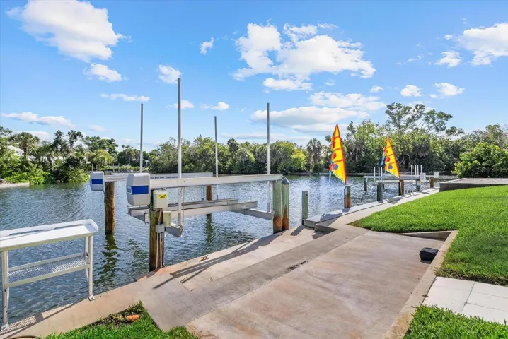 10,000 lb boat lift, separate jet ski lift, fish cleaning table, fresh water hose, eletric, new dock