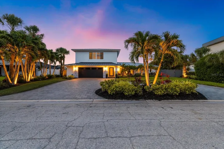 Professionally landscaped with upgraded lighting, and irrigation is connected to a well.