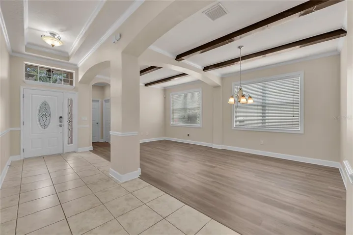 A privately located fourth bedroom and full bath next to the front entry would make the perfect private in-law suite or guest retreat.