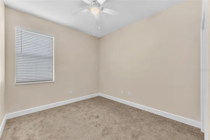 Secondary Bedroom #3. All bedrooms have newly installed carpet and are freshly painted.