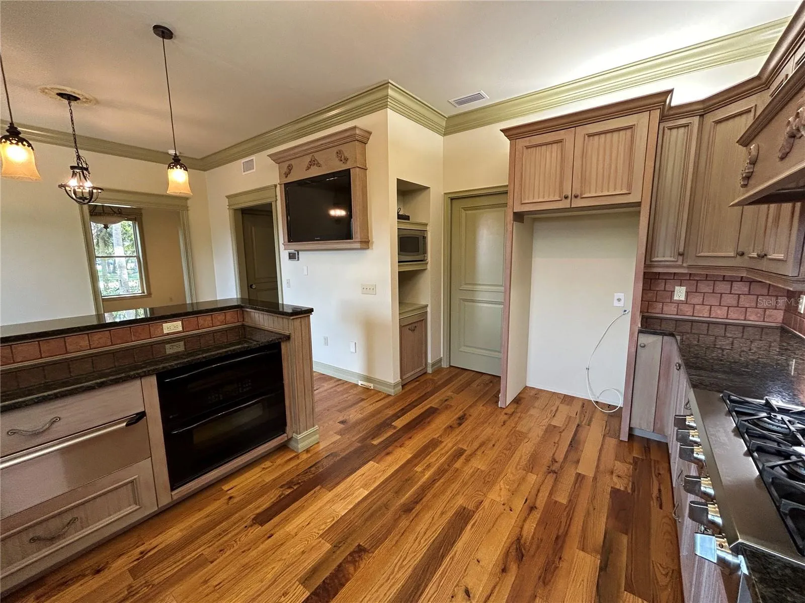 Built in warming drawer, under counter double oven, double can roll around garbage, microwave, prepped for built in Bunn double pot coffee maker, Refrigerator allowance.