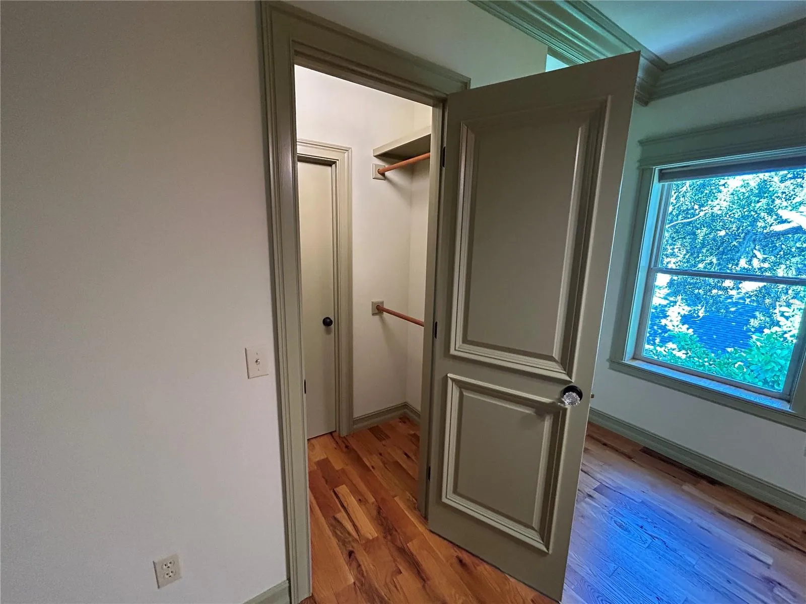 Bedroom 2 closet entrance with access to laundry chute access