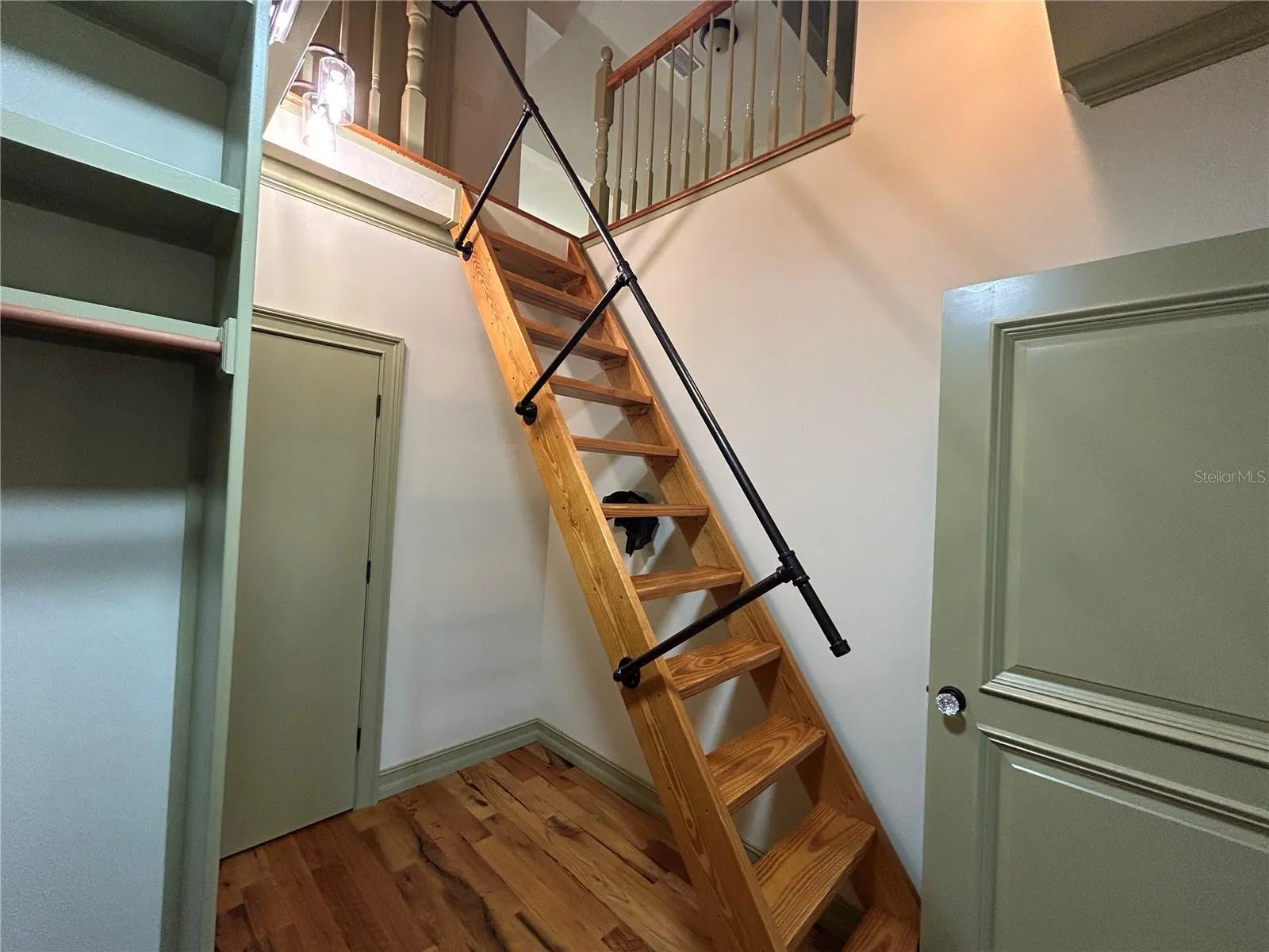 Primary Bedroom closet and access to finished attic
